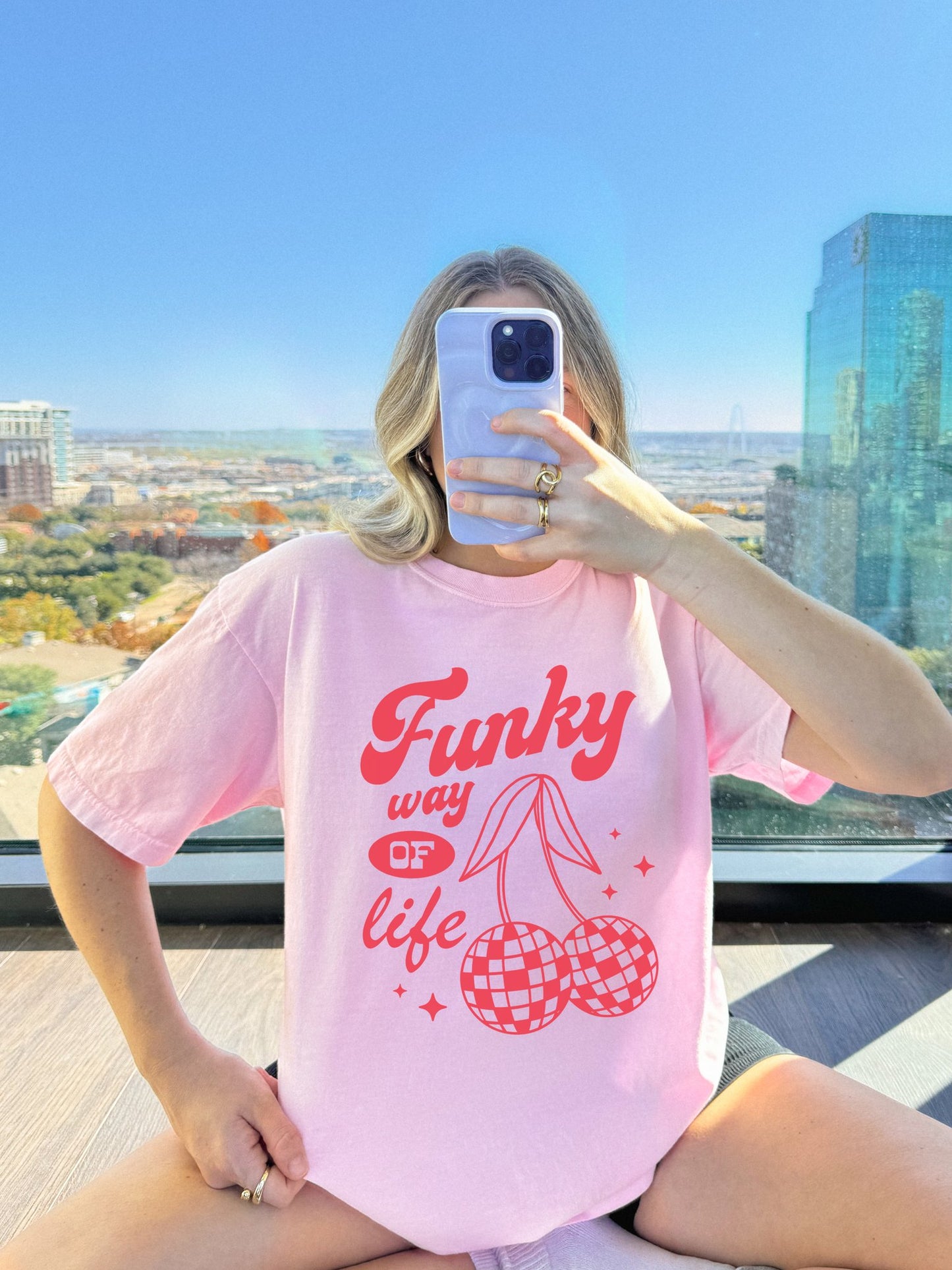 T-shirt with red retro cherry design featuring checkered disco ball cherries and funky typography
