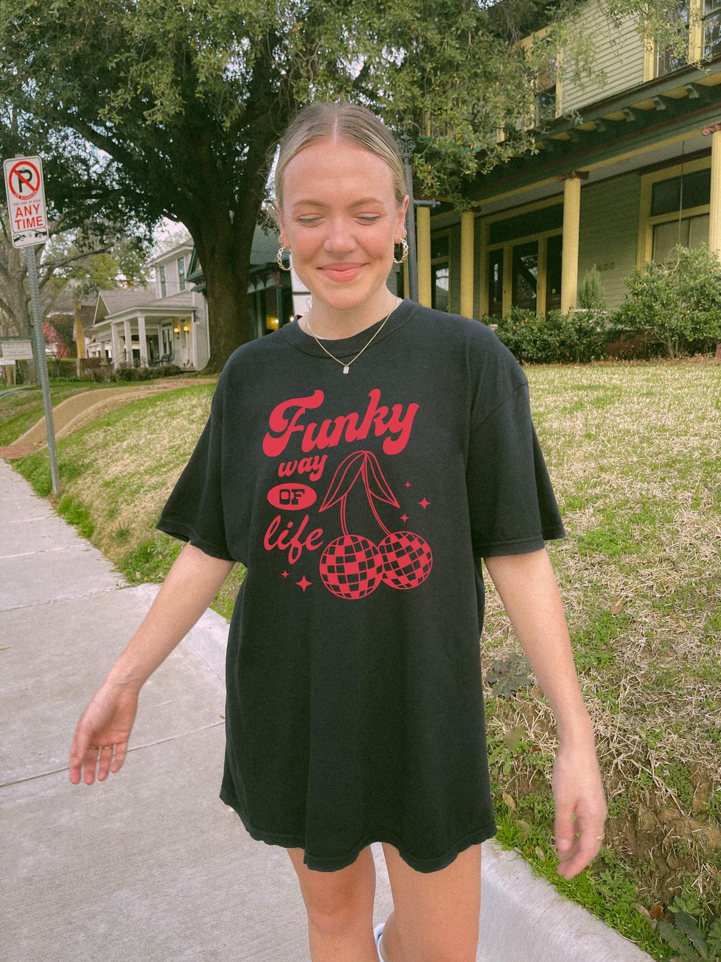 T-shirt with red retro cherry design featuring checkered disco ball cherries and funky typography