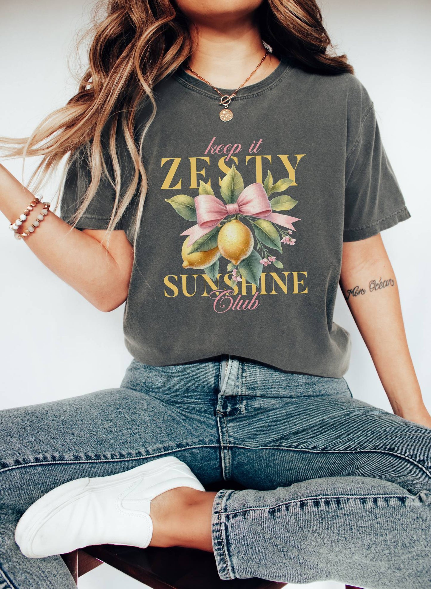 T-shirt with Keep It Zesty Sunshine Club text featuring watercolor lemons with pink bow and green leaves