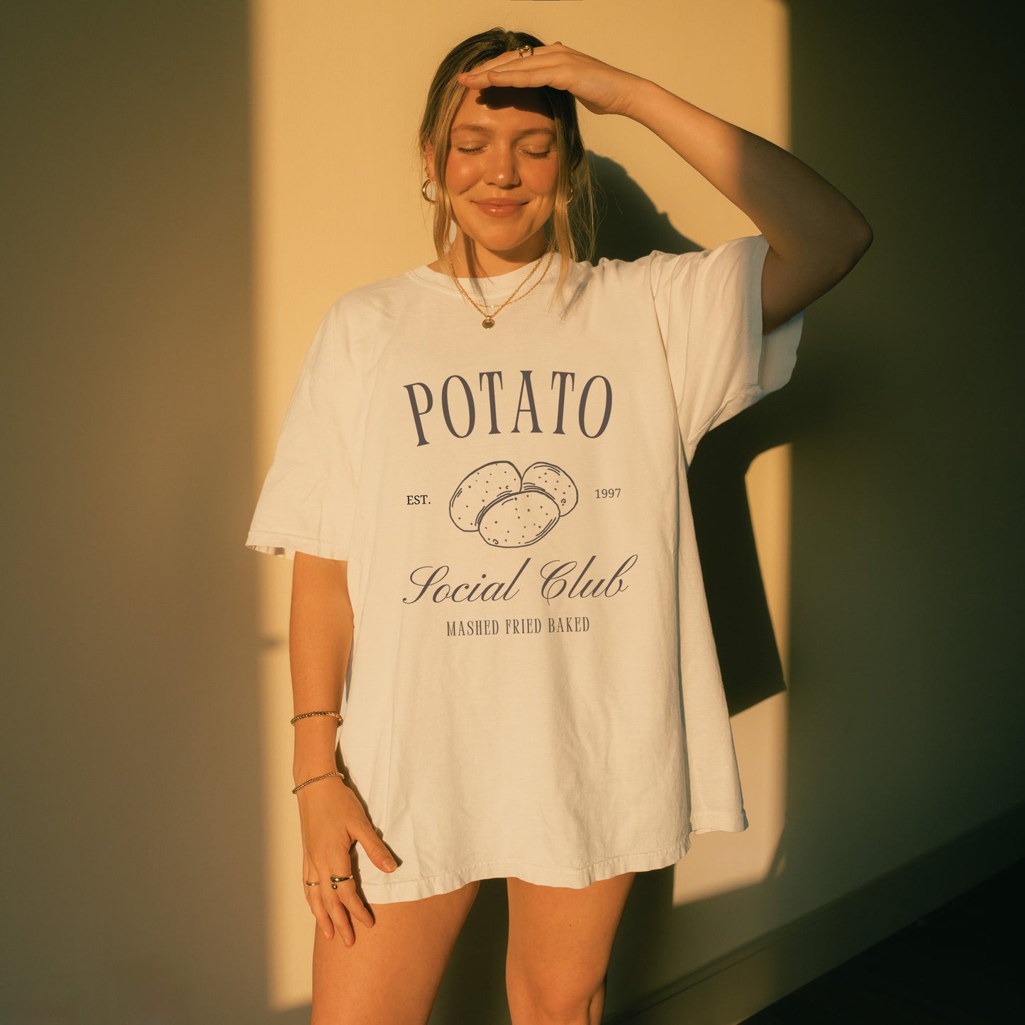 T-shirt with vintage Potato Social Club design featuring hand-drawn potatoes and brown text