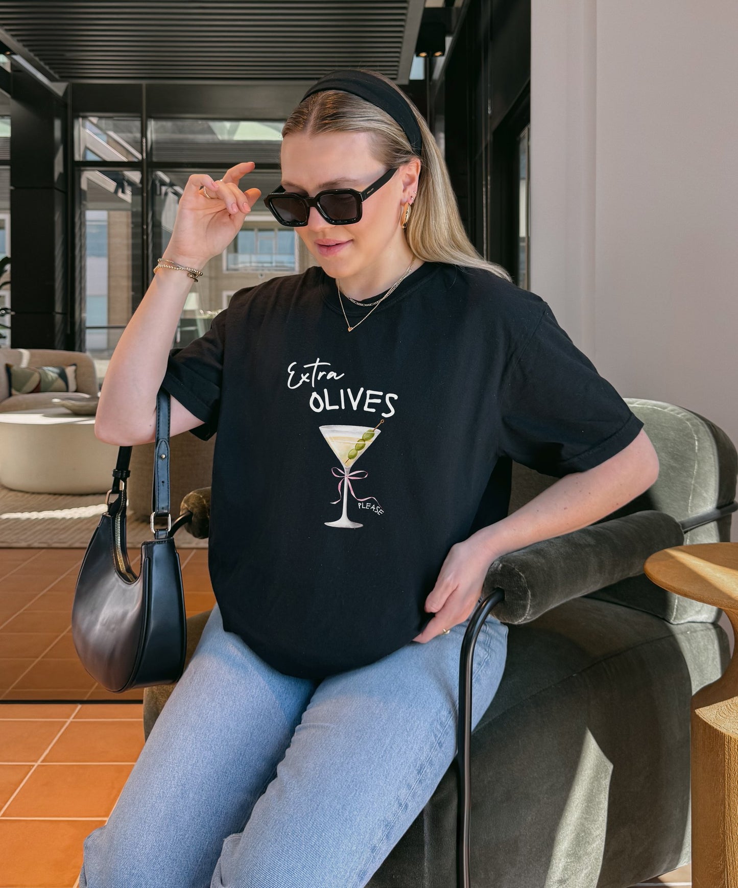 T-shirt design with martini glass, green olives, and pink bow saying Extra Olives Please