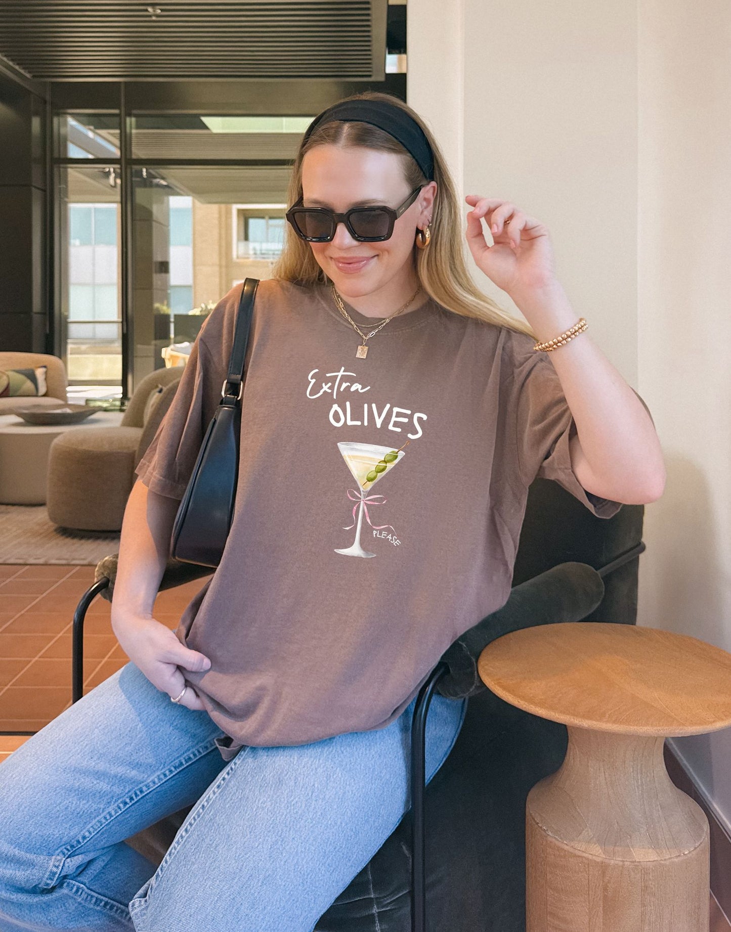 T-shirt design with martini glass, green olives, and pink bow saying Extra Olives Please