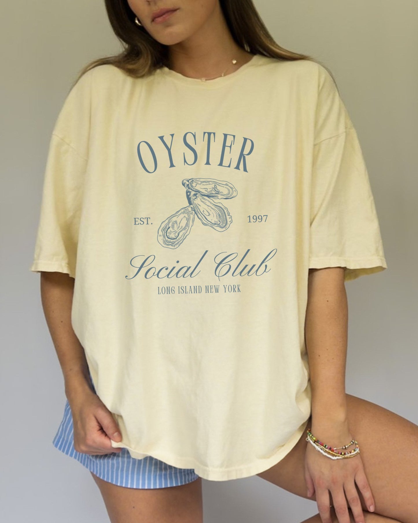 T-shirt with vintage oyster social club design featuring three detailed oyster illustrations