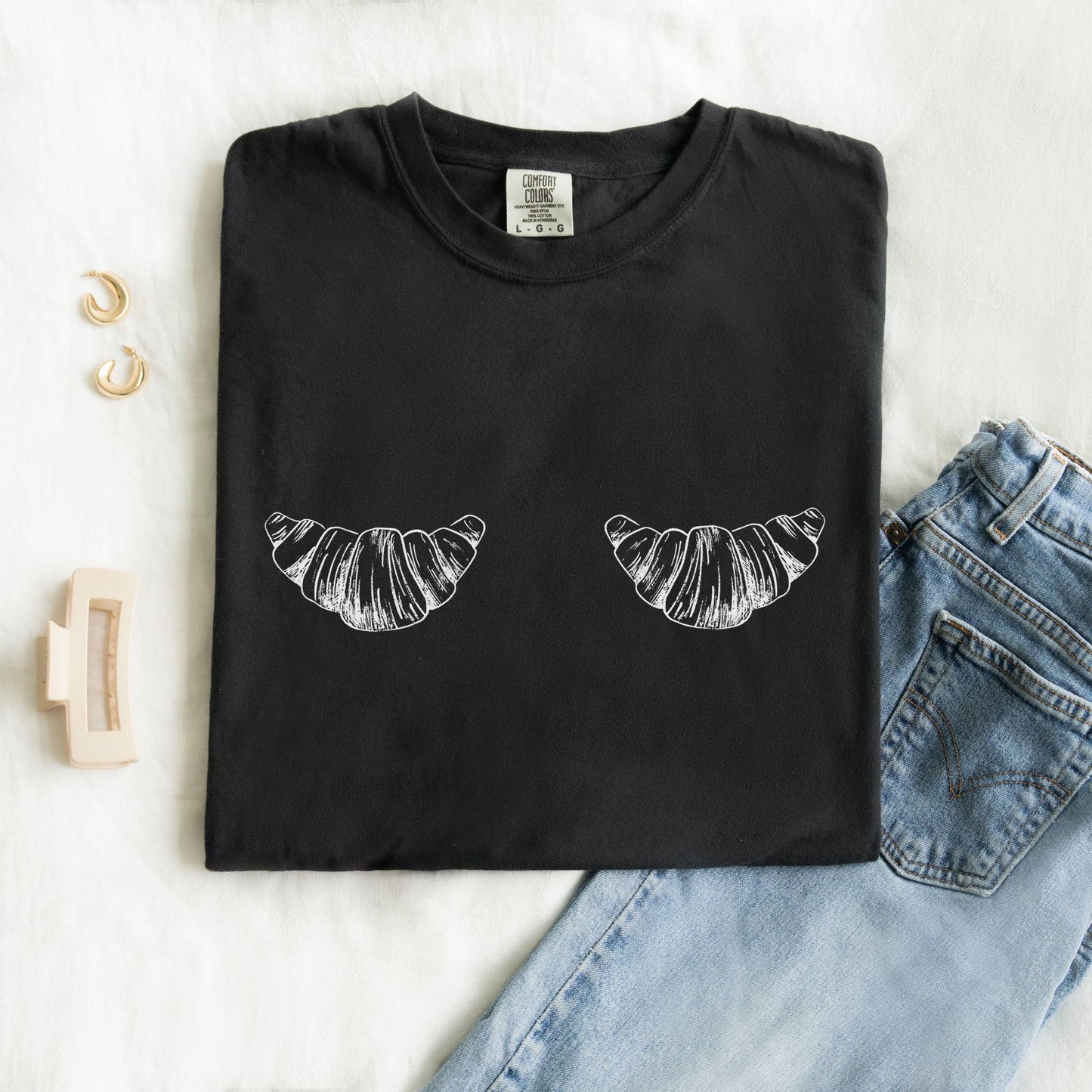 T-shirt with black and white hand-drawn croissant illustrations in vintage sketch style