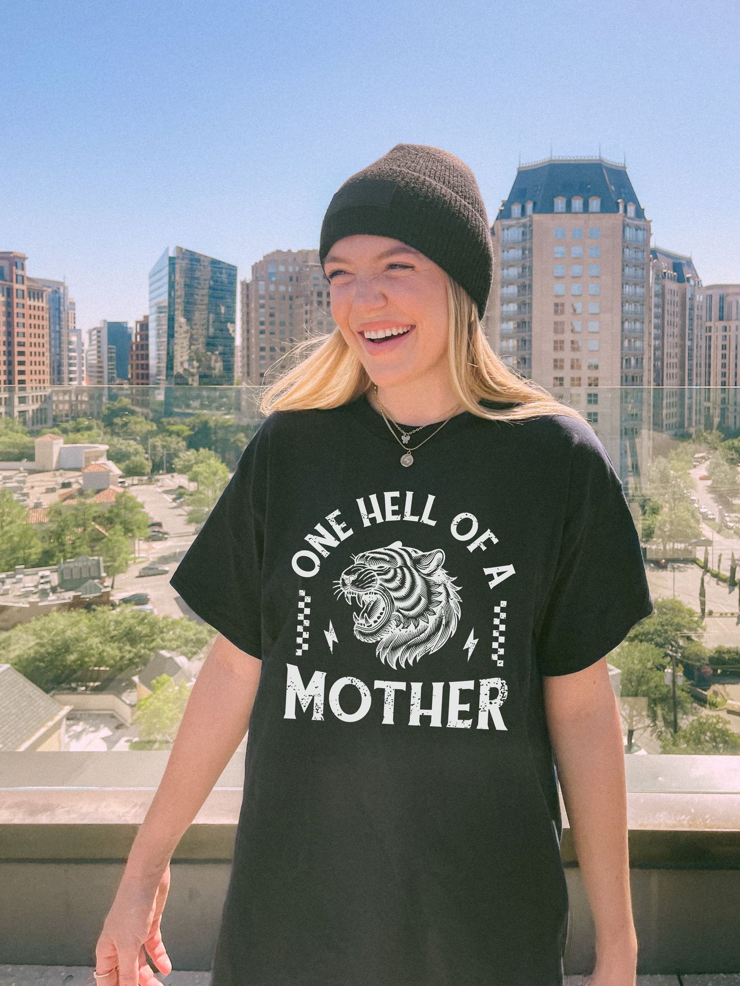 Black and white t-shirt with roaring tiger head and 'One Hell Of A Mother' text in distressed lettering