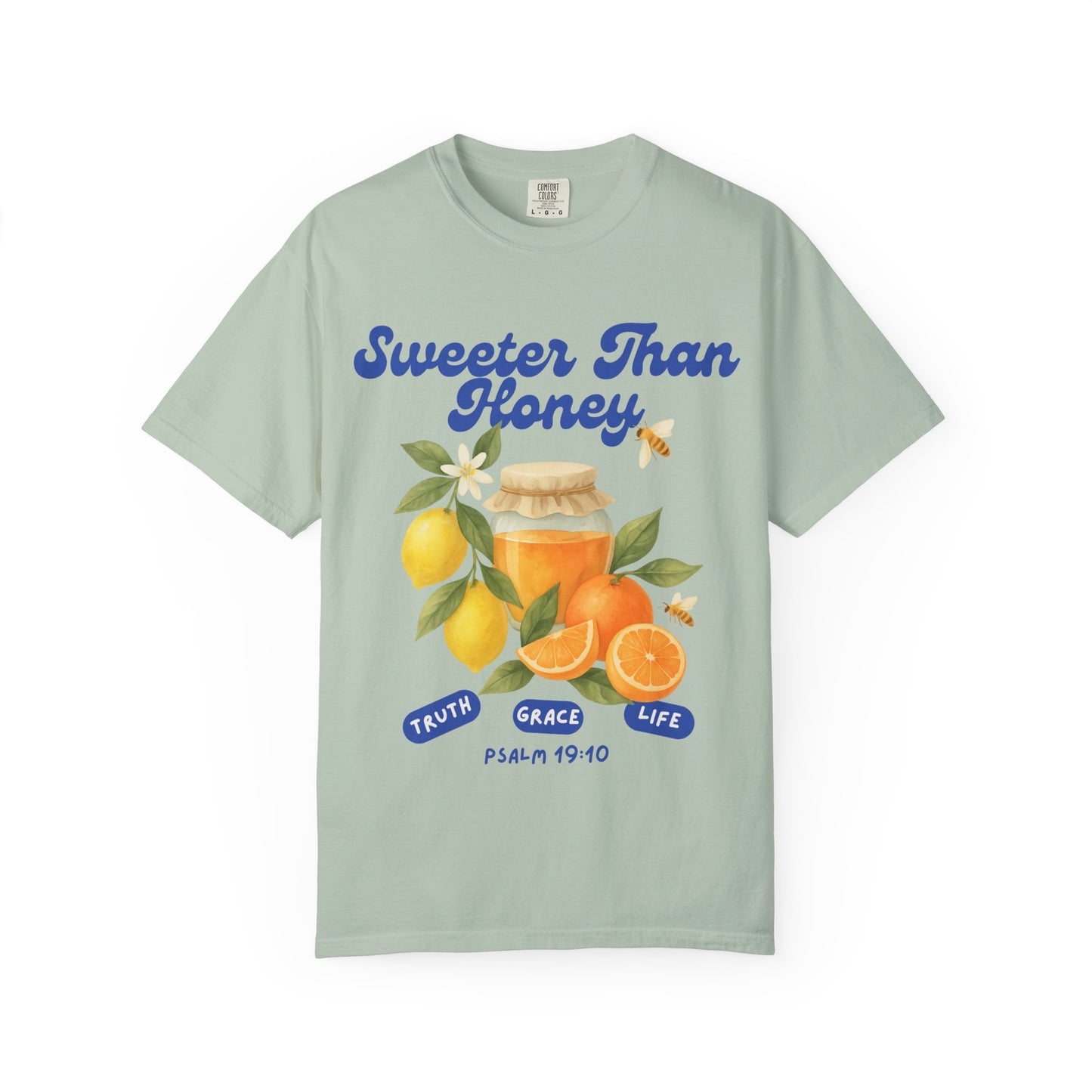 Christian t-shirt with Sweeter Than Honey Psalm 19:10 design featuring watercolor honey jar, citrus fruits, and bees