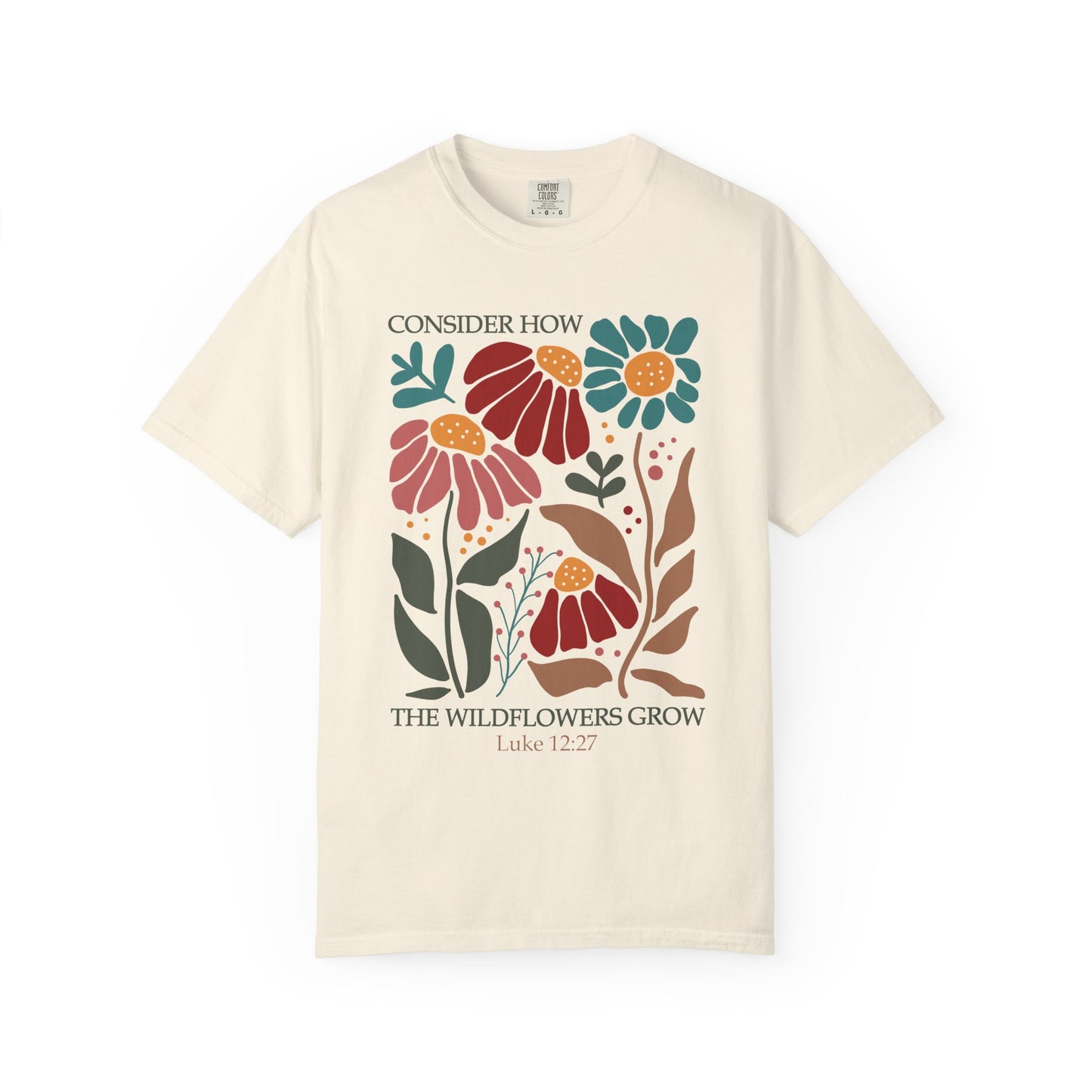 T-shirt with Luke 12:27 Bible verse and colorful wildflowers in red, pink, teal, and brown tones