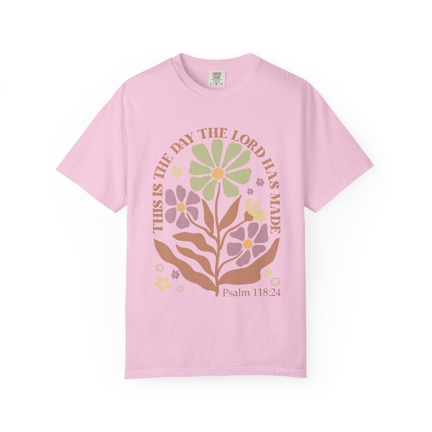 T-shirt with 'This is the Day' text, Psalm 118:24 verse, and floral design with protective hands in sage green, pink, and terracotta colors