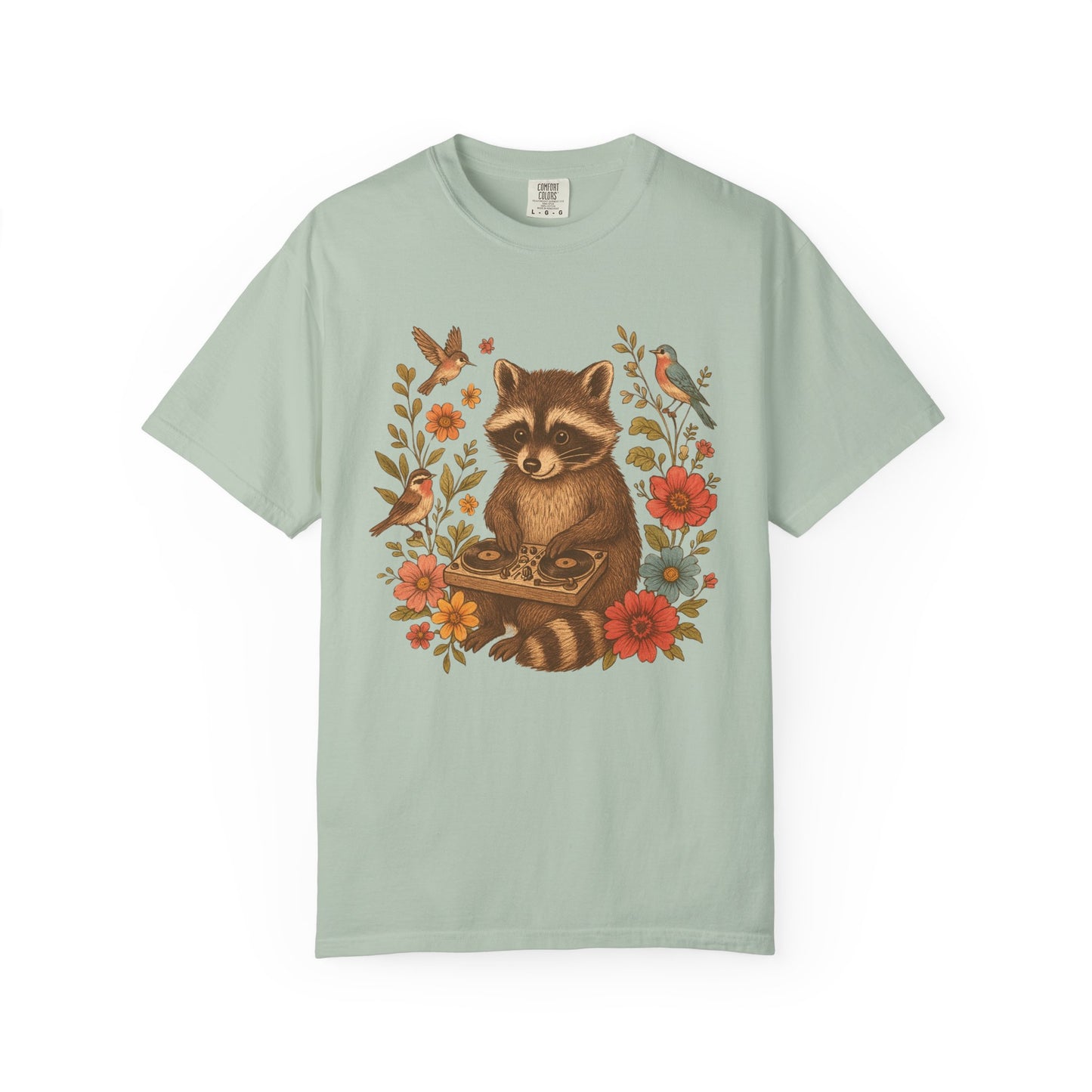 T-shirt with vintage raccoon DJ design surrounded by coral flowers, yellow blooms, and songbirds