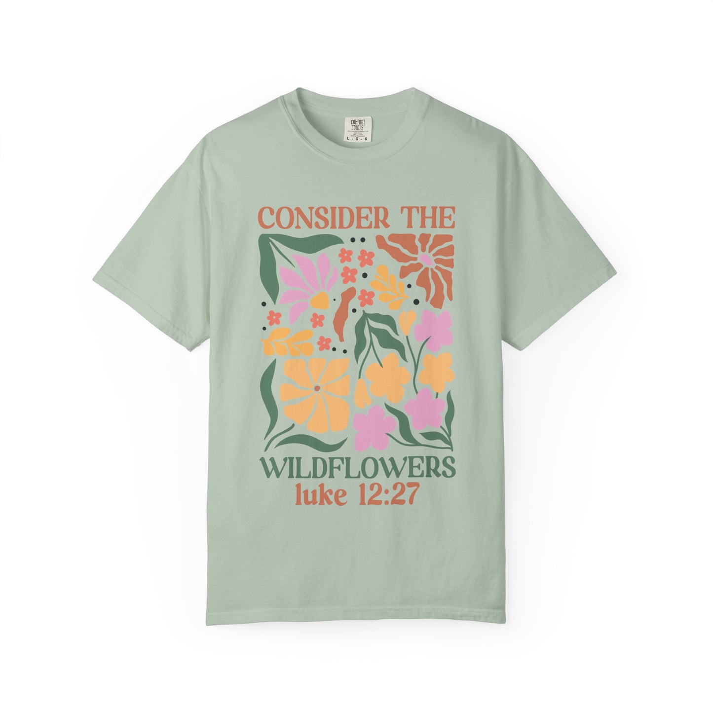 T-shirt with colorful wildflower design and 'Consider the Wildflowers Luke 12:27' bible verse text