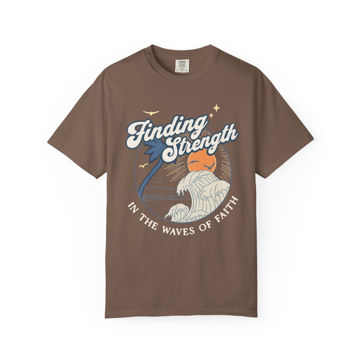 T-shirt with retro Christian design featuring palm tree, sunset, and ocean waves with Finding Strength text