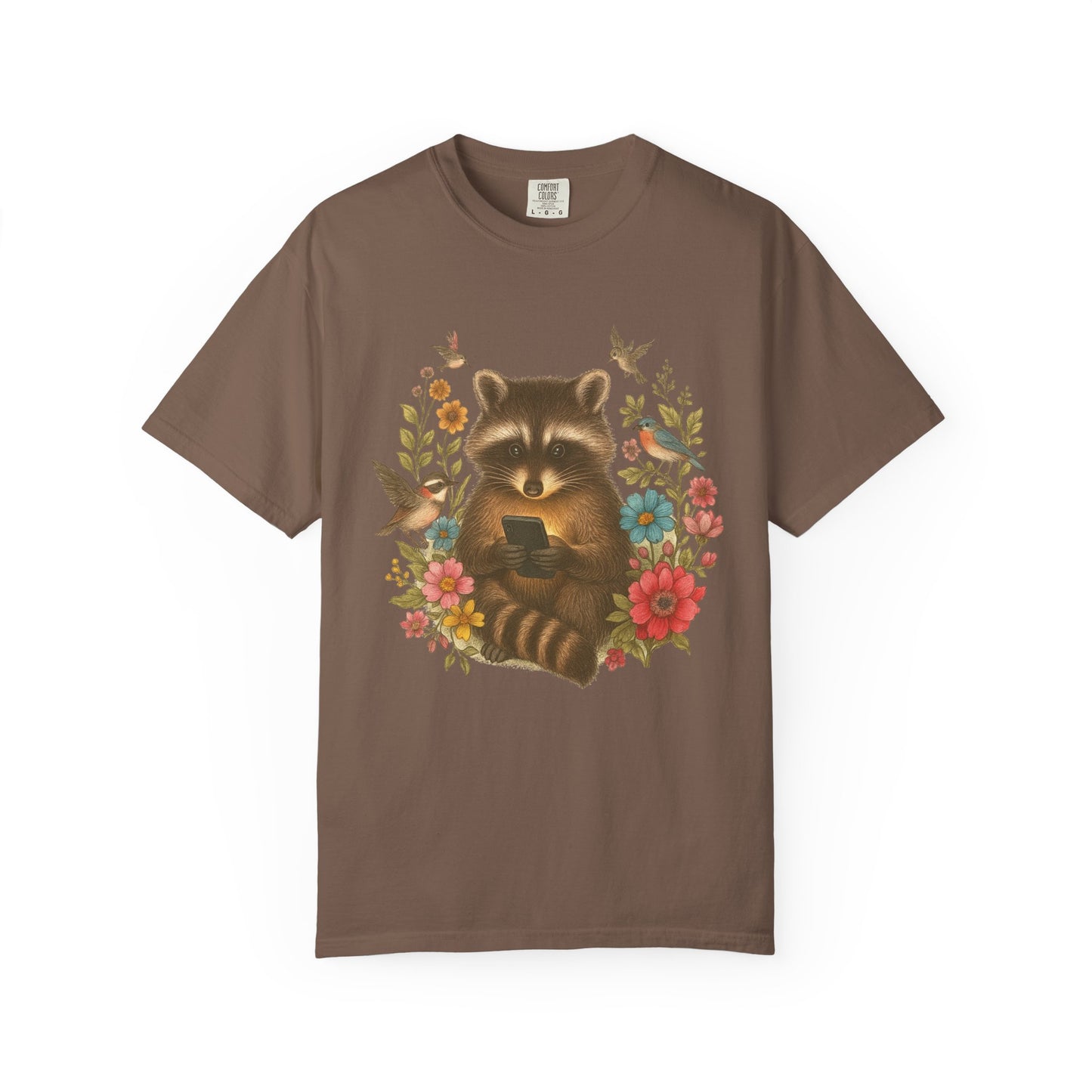 T-shirt design showing raccoon holding phone surrounded by colorful wildflowers and birds
