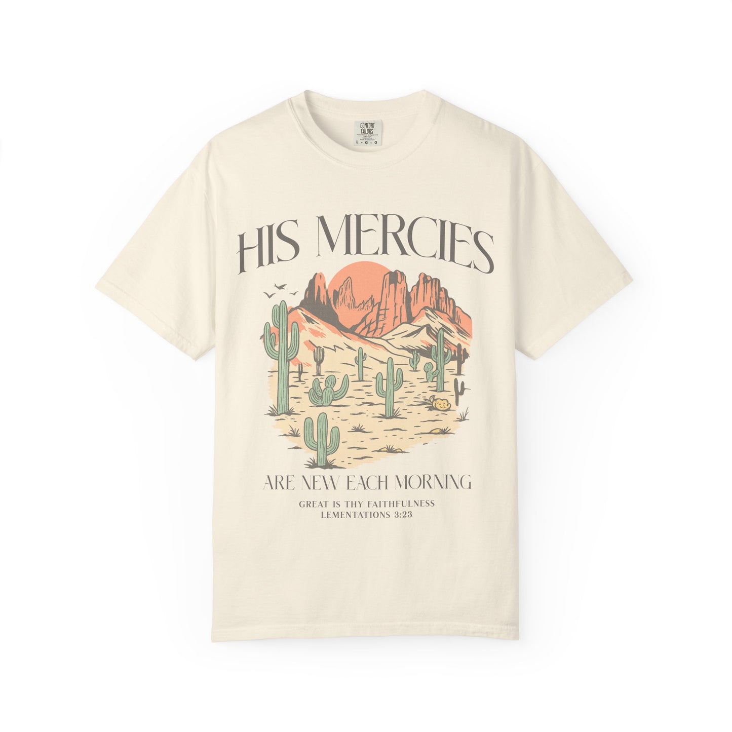 T-shirt with desert landscape design featuring cacti, mountains, and 'His Mercies Are New Each Morning' text with Lamentations 3:23 bible verse