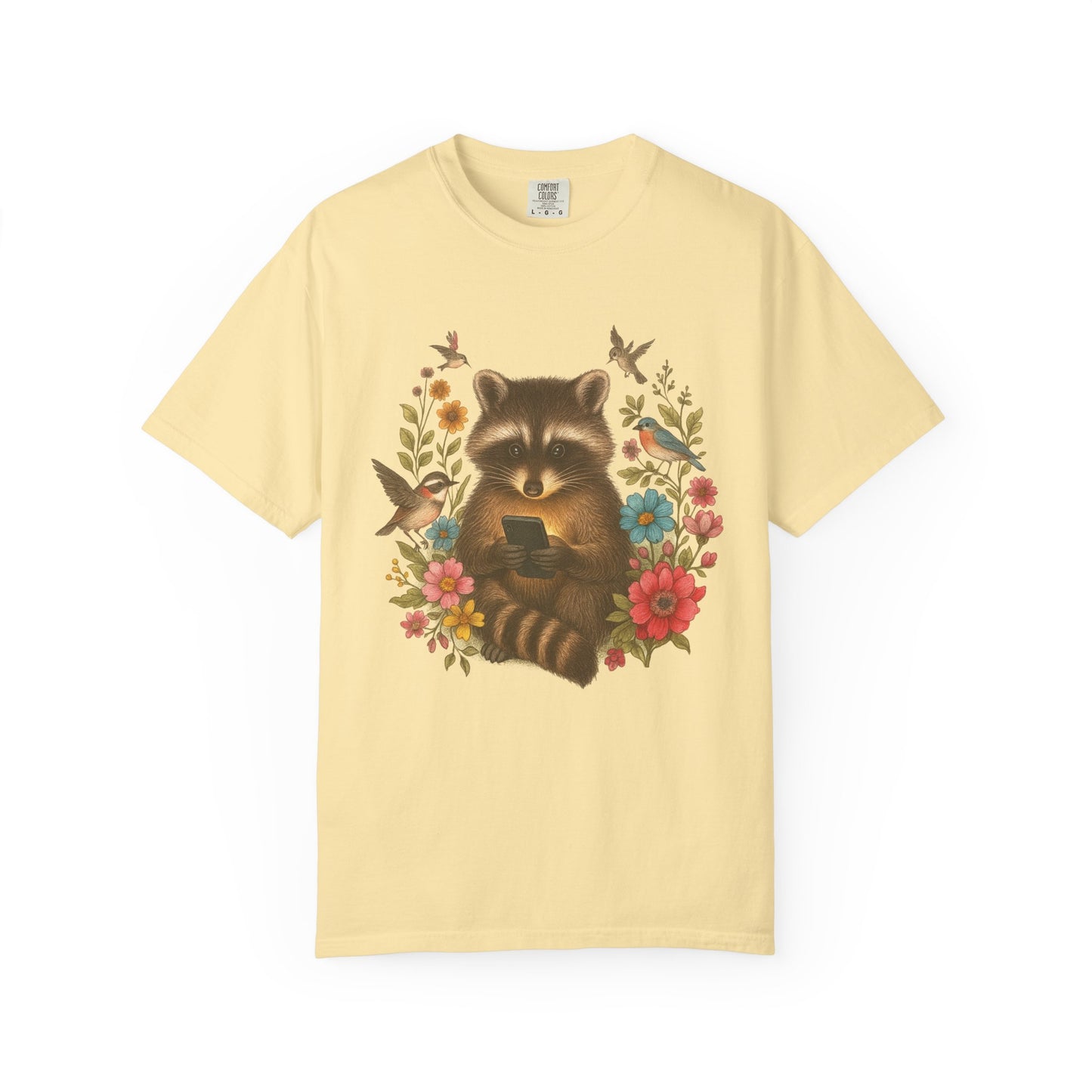 T-shirt design showing raccoon holding phone surrounded by colorful wildflowers and birds