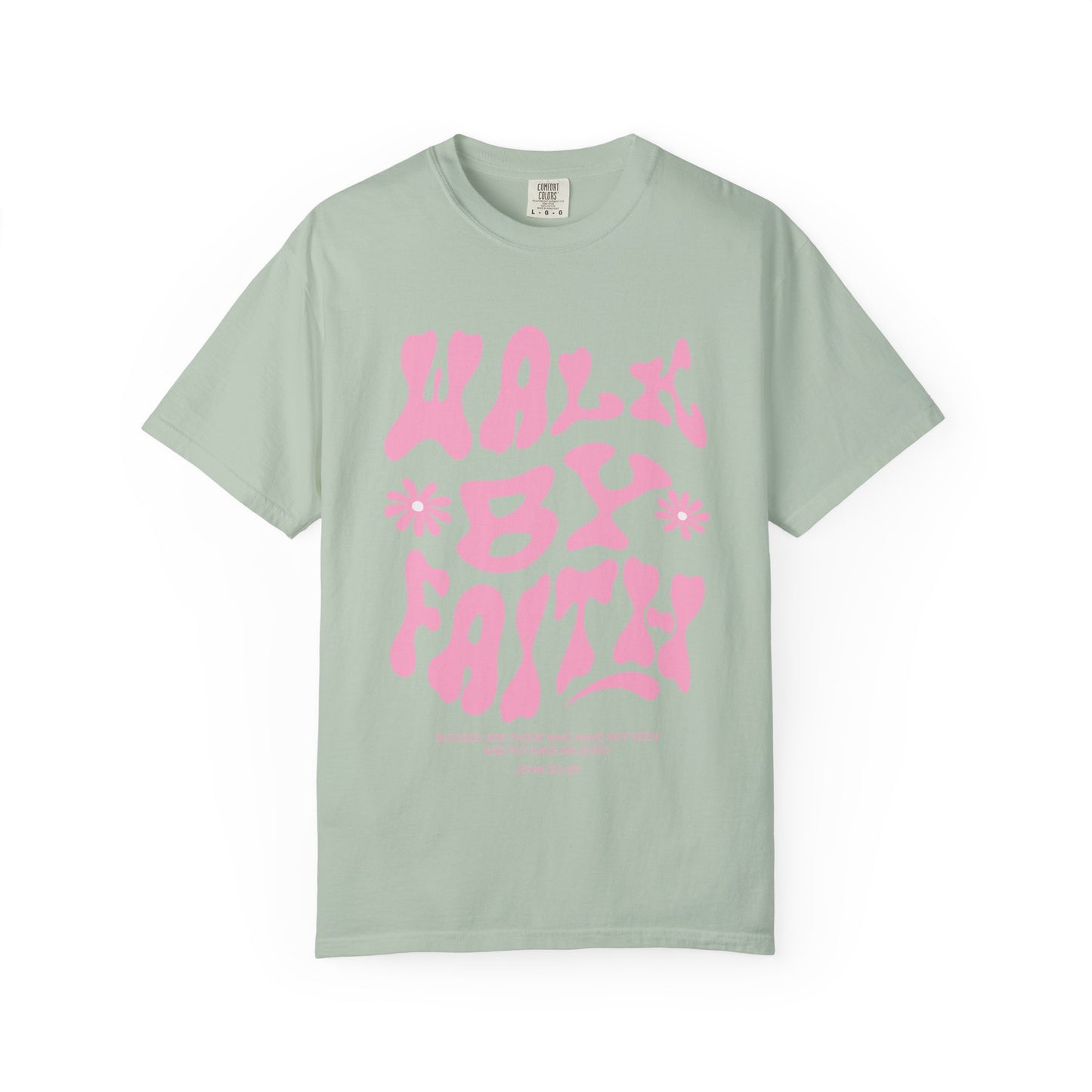 T-shirt with pink wavy font saying Walk By Faith with flowers and John 20:29 Bible verse
