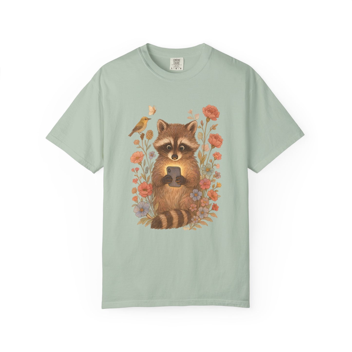 T-shirt with cute raccoon holding smartphone surrounded by coral and blue wildflowers