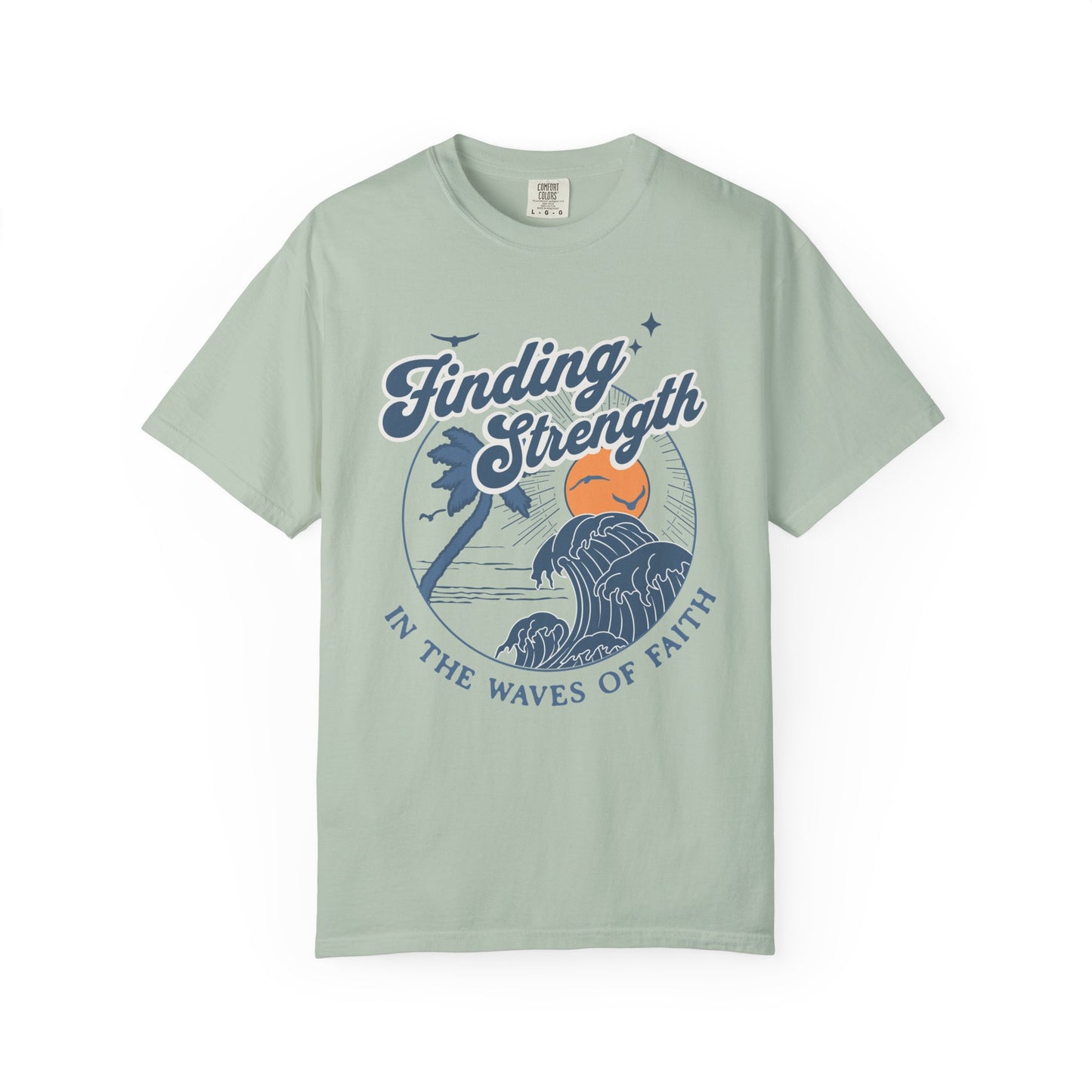 T-shirt with retro Christian design featuring palm tree, sunset, and ocean waves with Finding Strength text