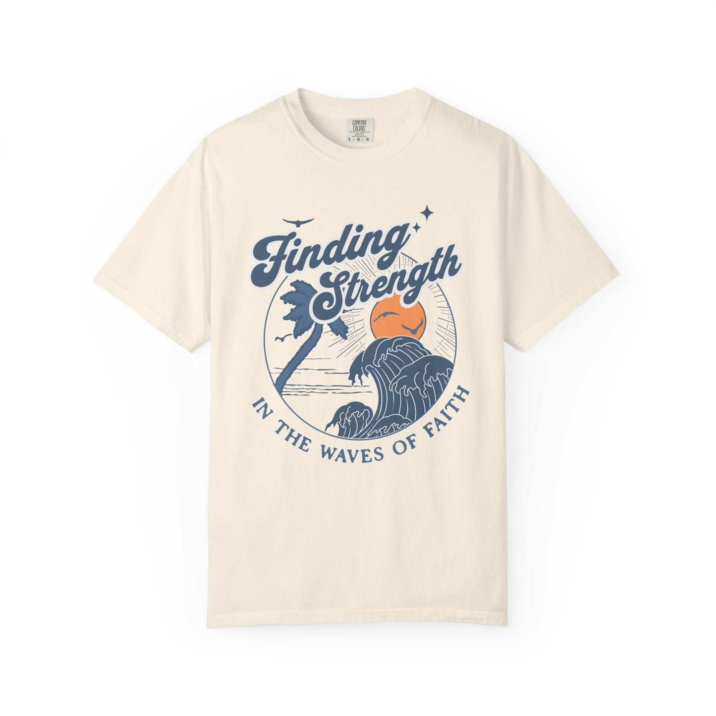 T-shirt with retro Christian design featuring palm tree, sunset, and ocean waves with Finding Strength text