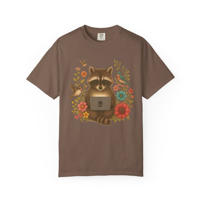T-shirt with vintage-style raccoon illustration surrounded by colorful wildflowers and birds