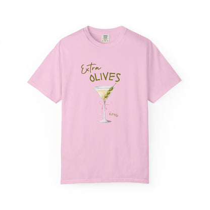 T-shirt design with martini glass, green olives, and pink bow saying Extra Olives Please