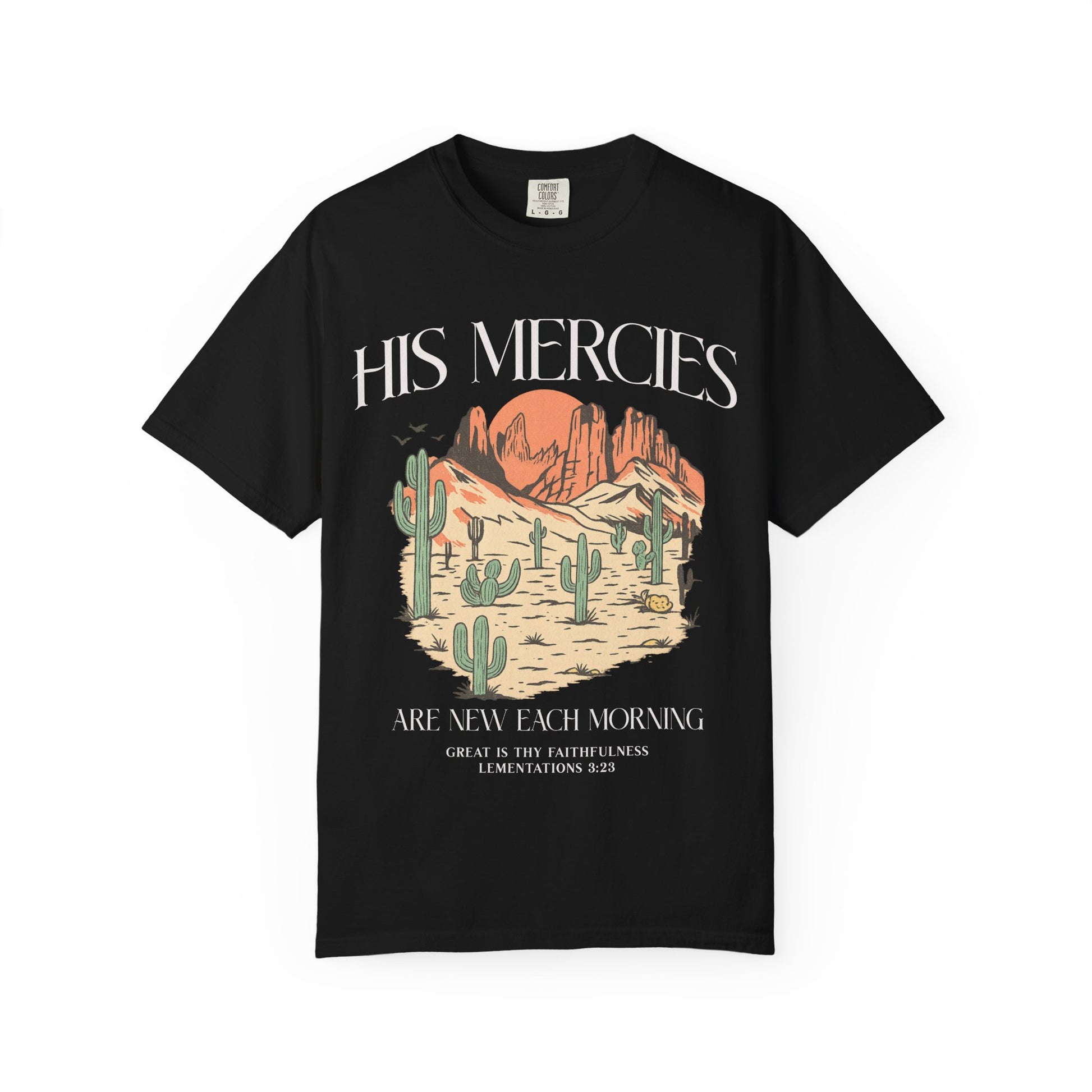 T-shirt with desert landscape design featuring cacti, mountains, and 'His Mercies Are New Each Morning' text with Lamentations 3:23 bible verse