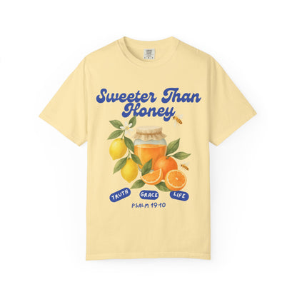 Christian t-shirt with Sweeter Than Honey Psalm 19:10 design featuring watercolor honey jar, citrus fruits, and bees