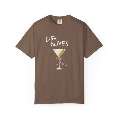 T-shirt design with martini glass, green olives, and pink bow saying Extra Olives Please
