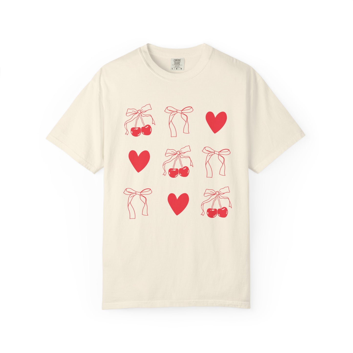 T-shirt with red cherry and bow pattern featuring hearts and ribbon bow designs