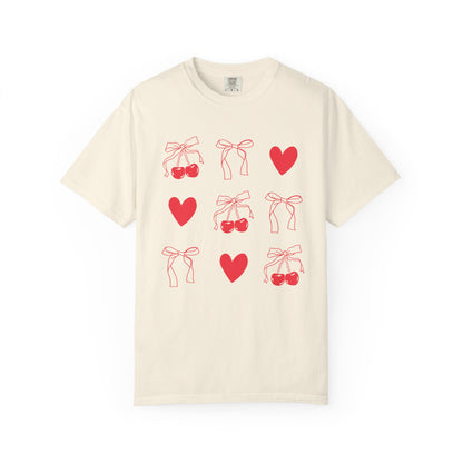 T-shirt with red cherry and bow pattern featuring hearts and ribbon bow designs