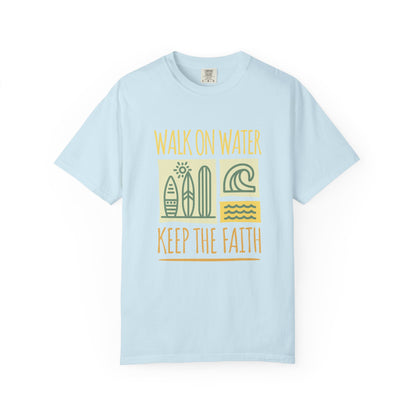 T-shirt with yellow Walk On Water Keep The Faith text, retro surfboard graphics and teal wave designs
