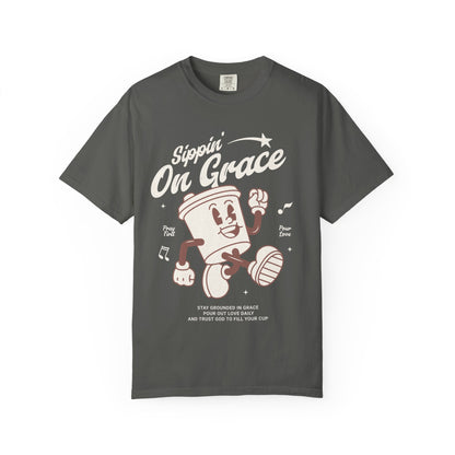 Christian t-shirt with cartoon coffee cup character and 'Sippin' On Grace' text in brown design