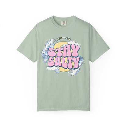 T-shirt with wavy font Stay Salty Matthew 5:13 text in pink bubble letters with ocean waves and flowers