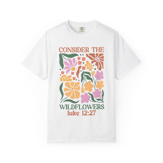 T-shirt with colorful wildflower design and 'Consider the Wildflowers Luke 12:27' bible verse text