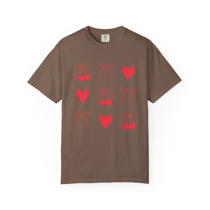T-shirt with red cherry and bow pattern featuring hearts and ribbon bow designs