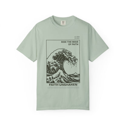 T-shirt with ocean wave design featuring 'Ride The Wave of Faith' and 'Faith Unshaken' text