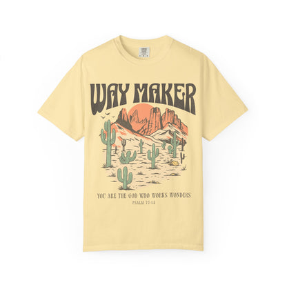 T-shirt with Way Maker text, desert landscape featuring cacti, mountains, and orange sunset with Psalm 77:14 verse