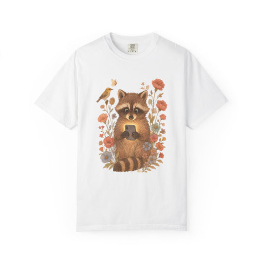 T-shirt with cute raccoon holding smartphone surrounded by coral and blue wildflowers
