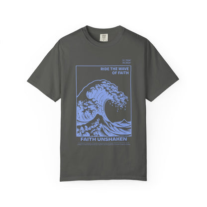 T-shirt with blue ocean wave design featuring 'Ride The Wave Of Faith' and 'Faith Unshaken' text