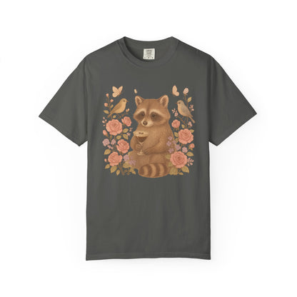 T-shirt with raccoon holding espresso martini glass surrounded by pink roses and birds