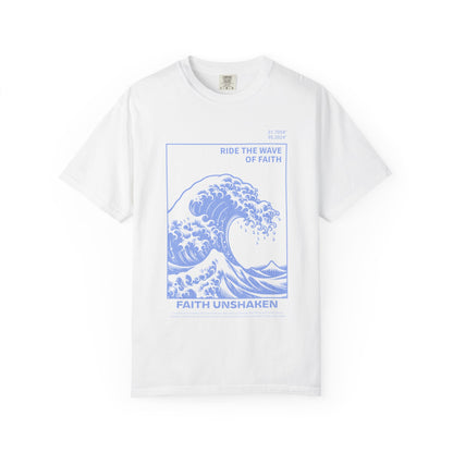T-shirt with blue ocean wave design featuring 'Ride The Wave Of Faith' and 'Faith Unshaken' text