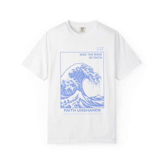 T-shirt with blue ocean wave design featuring 'Ride The Wave Of Faith' and 'Faith Unshaken' text