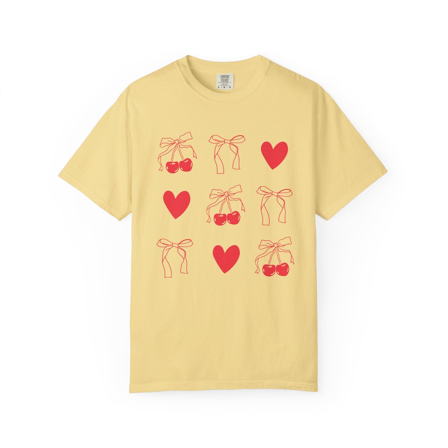 T-shirt with red cherry and bow pattern featuring hearts and ribbon bow designs
