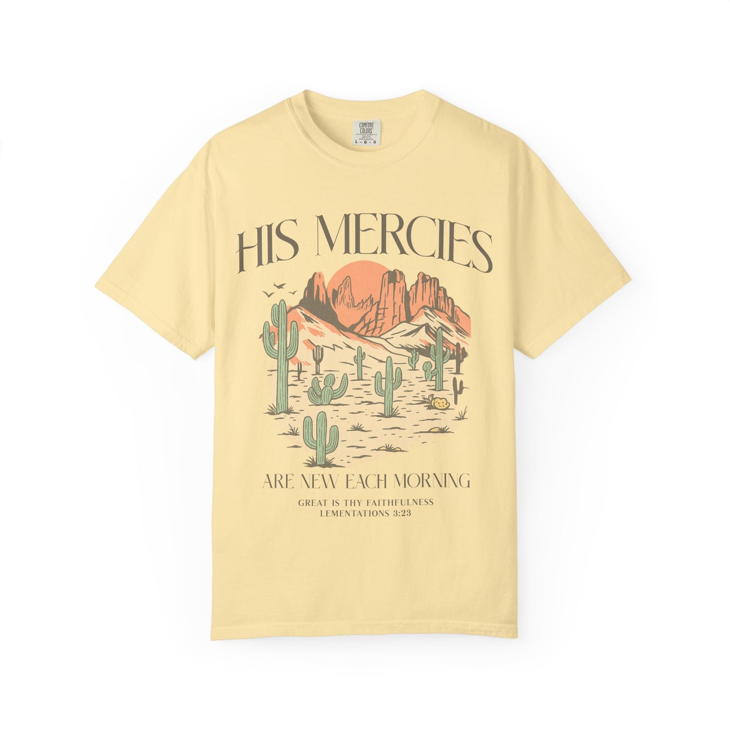 T-shirt with desert landscape design featuring cacti, mountains, and 'His Mercies Are New Each Morning' text with Lamentations 3:23 bible verse
