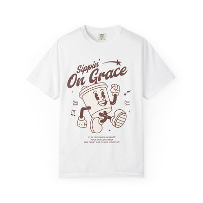 Christian t-shirt with cartoon coffee cup character and 'Sippin' On Grace' text in brown design