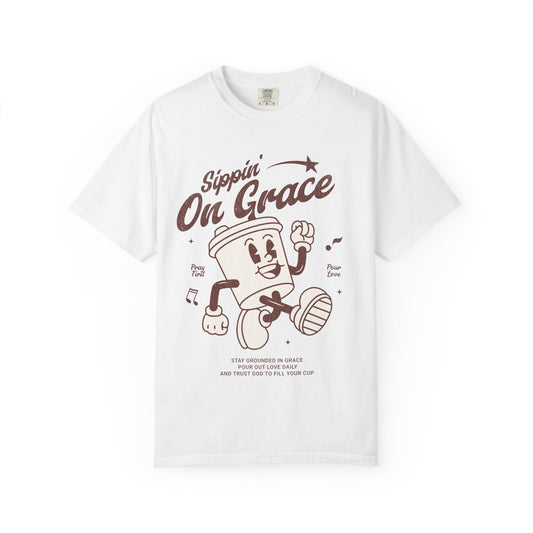 Christian t-shirt with cartoon coffee cup character and 'Sippin' On Grace' text in brown design