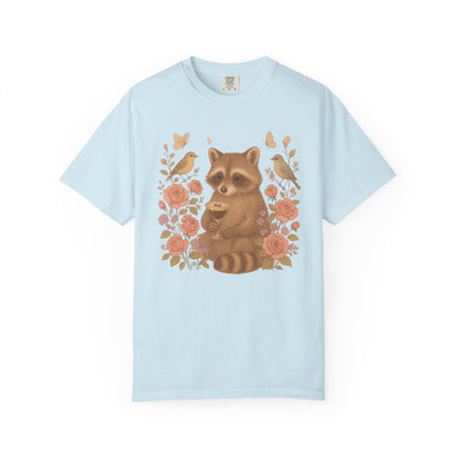 T-shirt with raccoon holding espresso martini glass surrounded by pink roses and birds