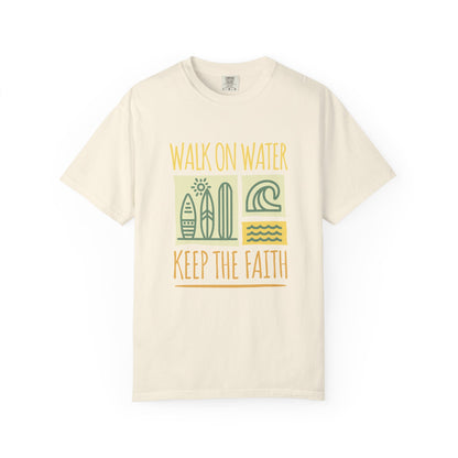 T-shirt with yellow Walk On Water Keep The Faith text, retro surfboard graphics and teal wave designs