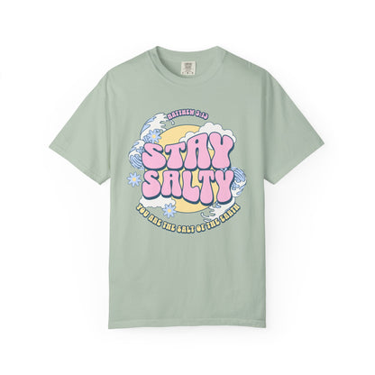 Christian t-shirt with pink 'Stay Salty' text, Matthew 5:13 verse, ocean waves and daisy flowers