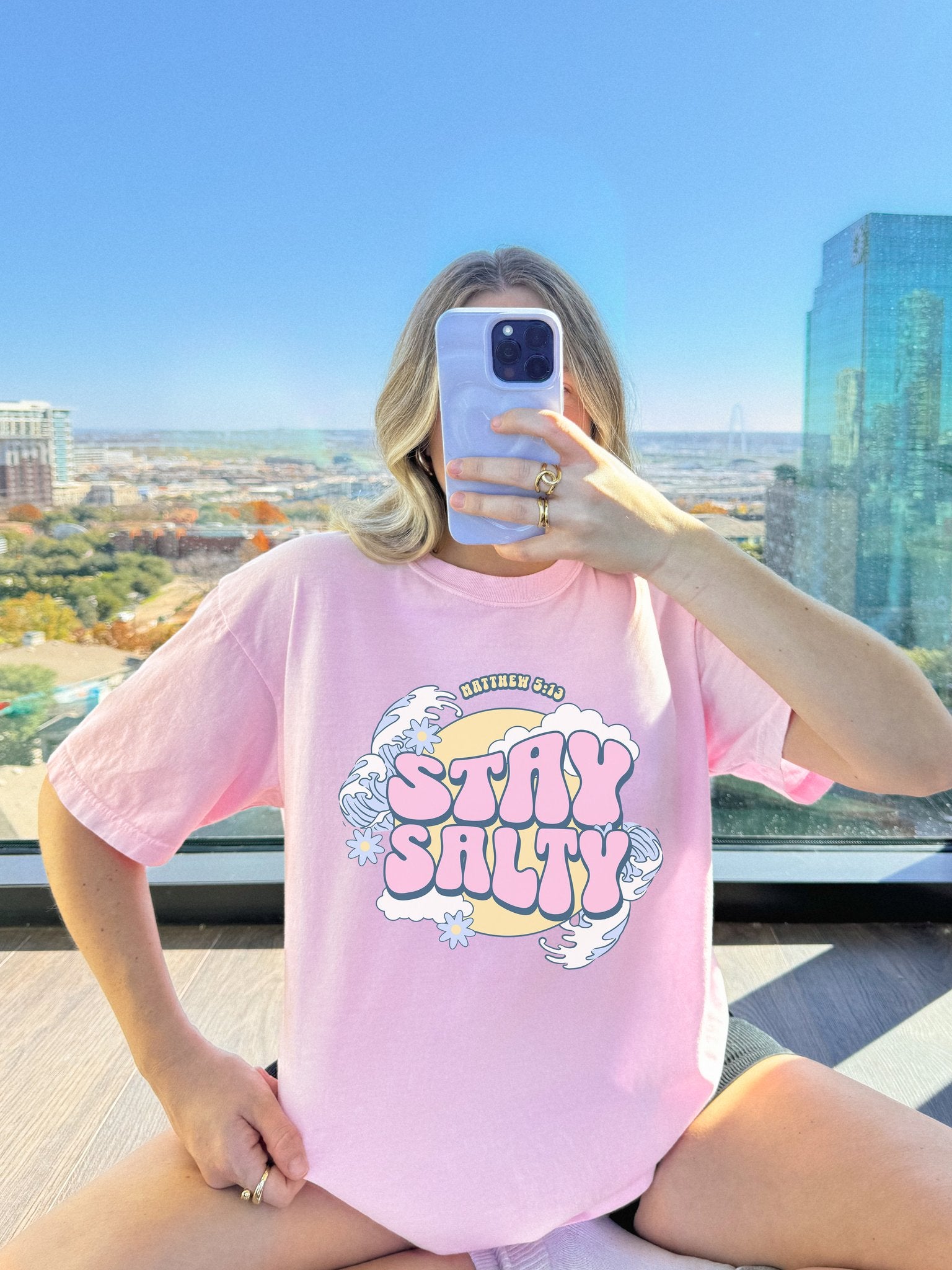 T-shirt with wavy font Stay Salty Matthew 5:13 text in pink bubble letters with ocean waves and flowers