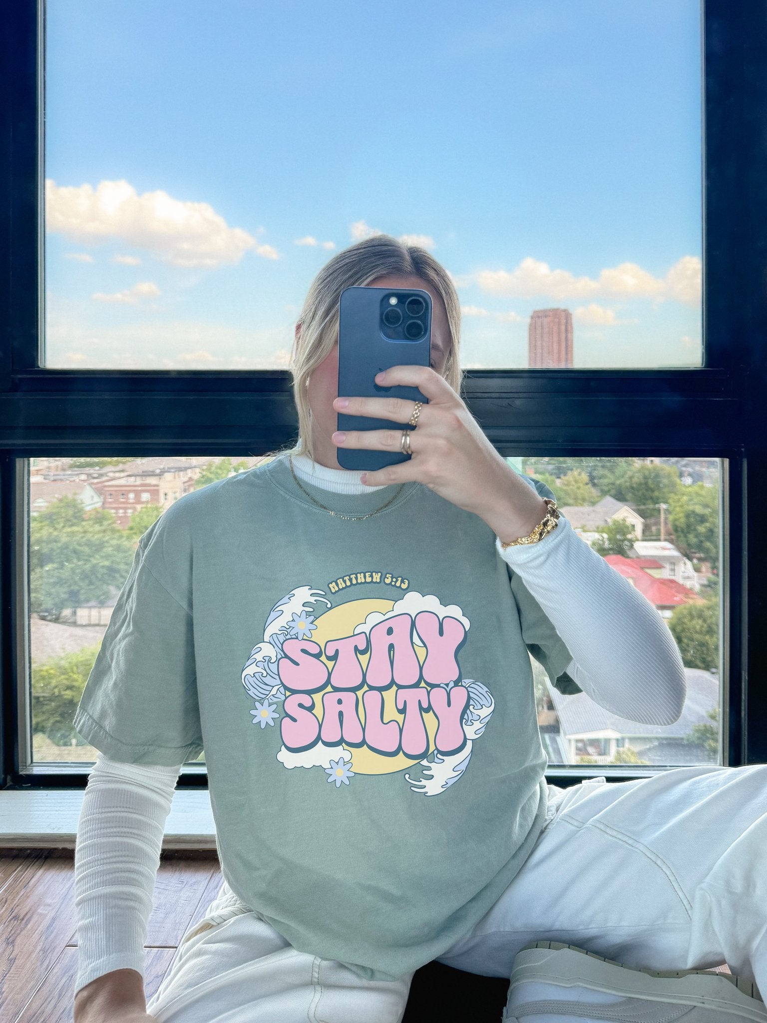 T-shirt with wavy font Stay Salty Matthew 5:13 text in pink bubble letters with ocean waves and flowers
